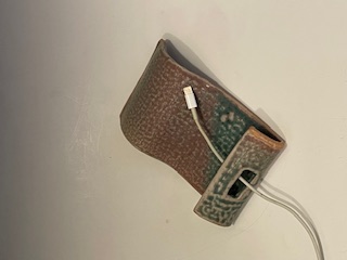 Ceramic cell phone holder with slit for charging cord